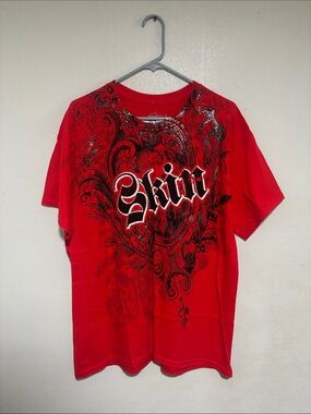 Red skin industries shirt with silver graphic on front and back Size Large